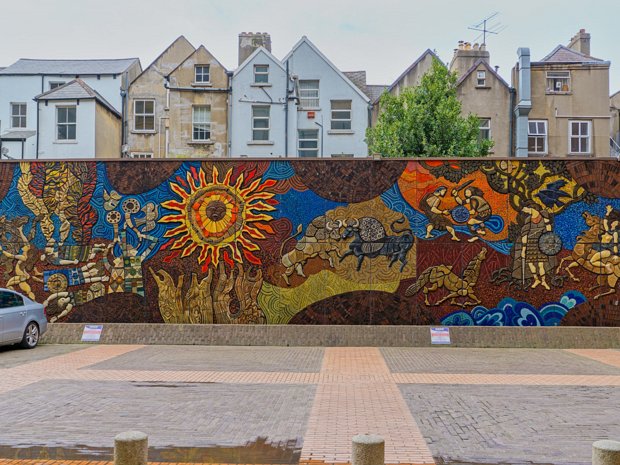 HAS BEEN DEMOLISHED The Táin Wall, created in 1974, stood as a testament to Kinney's artistic vision and his deep appreciation for Irish...