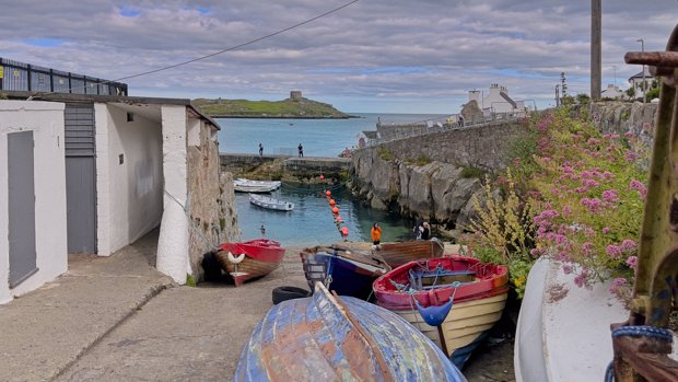 COLIEMORE HARBOUR JULY 2022 Coliemore Harbour is a small, historic harbour that has served as a vital hub for the local community for centuries....