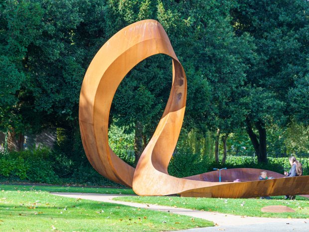 EMBRACED LOOP The sculpture is an abstract form of the HIV symbol, the red ribbon, shaped into a parametric loop. This loop forms an...